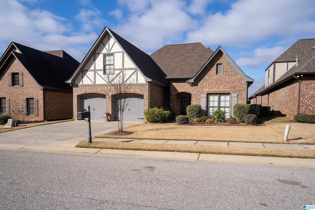 tudor house featuring a garage