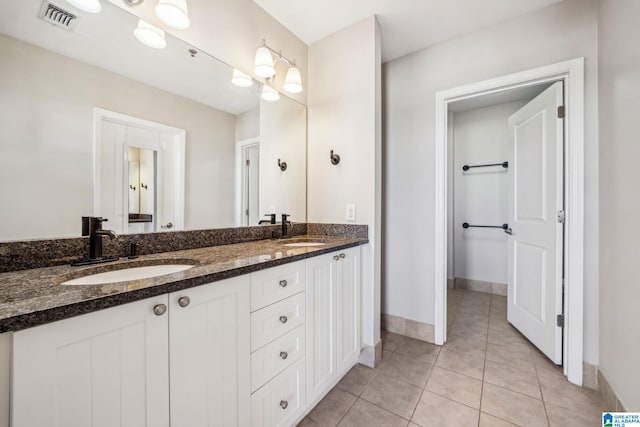 bathroom with vanity and tile patterned flooring