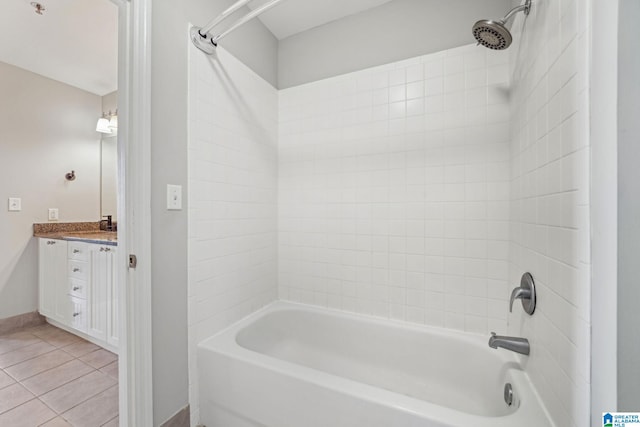 bathroom with vanity, tile patterned flooring, and washtub / shower combination