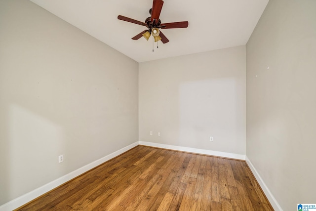 spare room with ceiling fan and hardwood / wood-style flooring