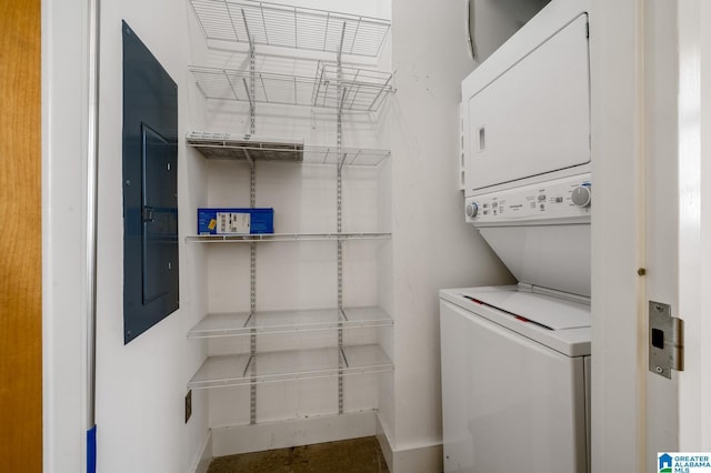 laundry area with stacked washer and clothes dryer