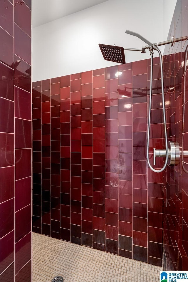 bathroom with a tile shower