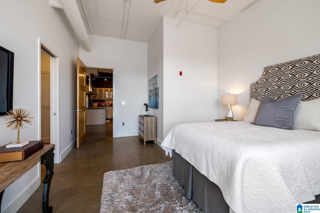 bedroom with ceiling fan and a towering ceiling