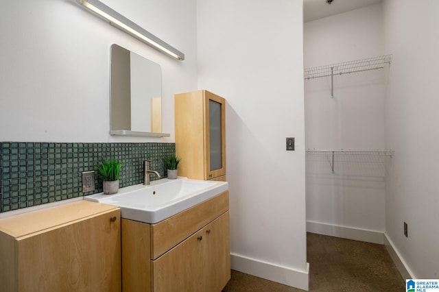 bathroom featuring decorative backsplash and vanity