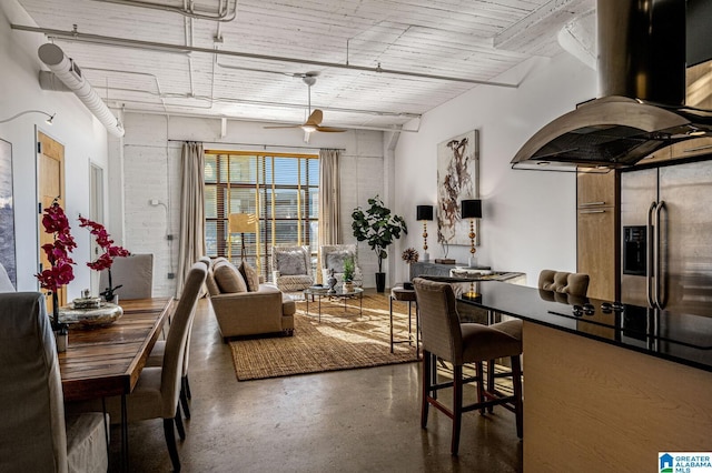 interior space with a high ceiling and ceiling fan