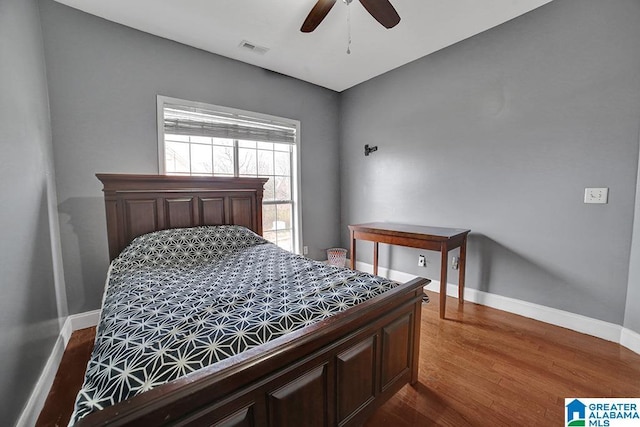 bedroom featuring dark wood-type flooring and ceiling fan