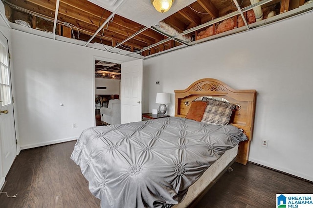 bedroom featuring dark wood-type flooring