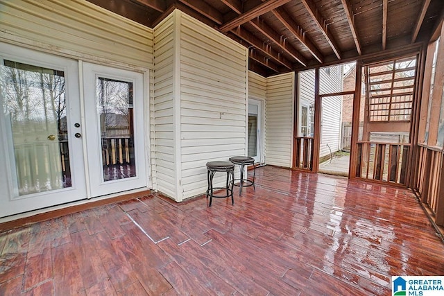 unfurnished sunroom with a wealth of natural light