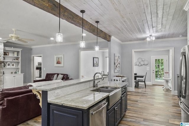 kitchen with wooden ceiling, hanging light fixtures, sink, an island with sink, and appliances with stainless steel finishes