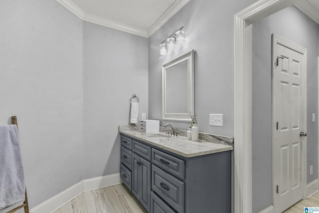 bathroom featuring crown molding and vanity