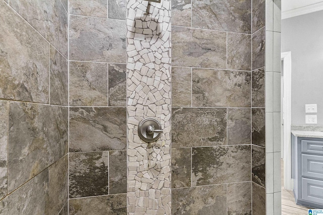 interior details with a tile shower