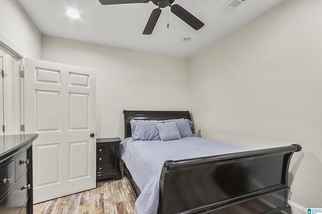 bedroom featuring ceiling fan and light hardwood / wood-style floors