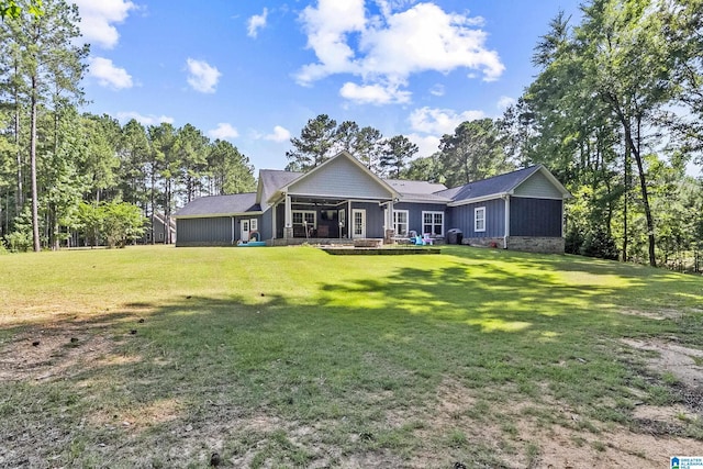 rear view of house with a lawn