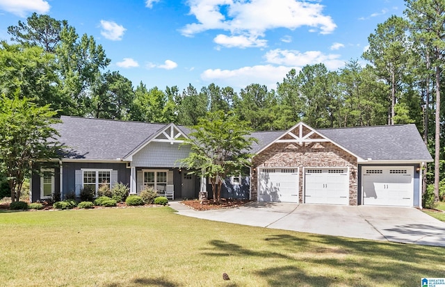 craftsman inspired home with a garage and a front yard