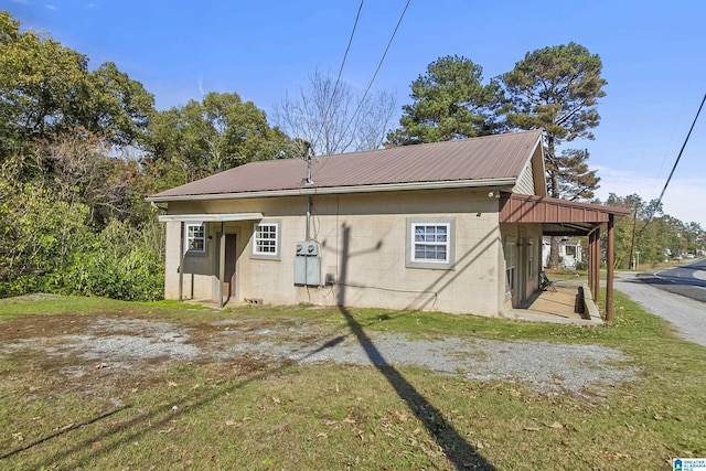 view of side of home featuring a yard