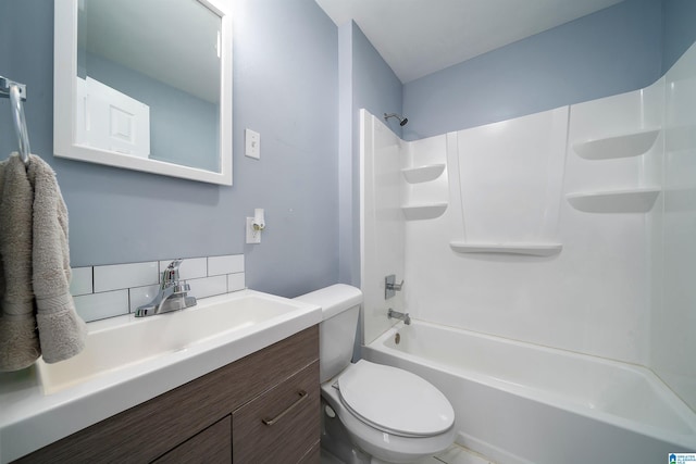 full bathroom with vanity, tub / shower combination, toilet, and backsplash