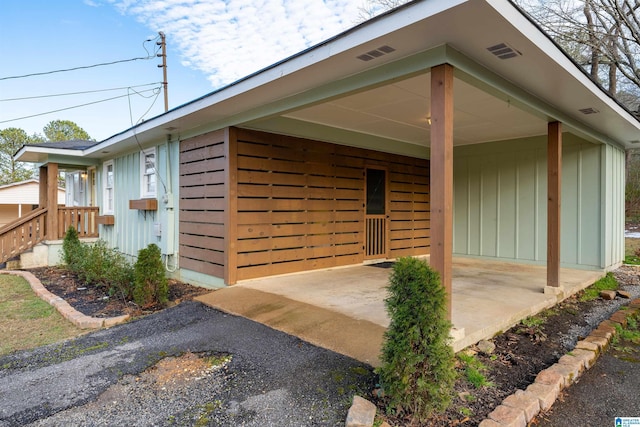 exterior space featuring a carport