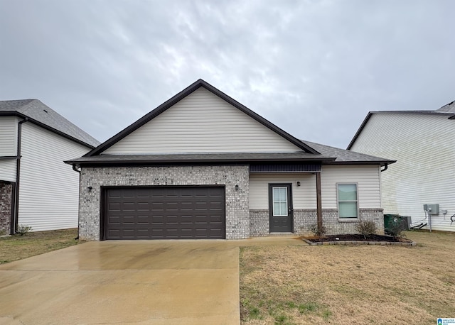 view of front facade with a garage and a front lawn