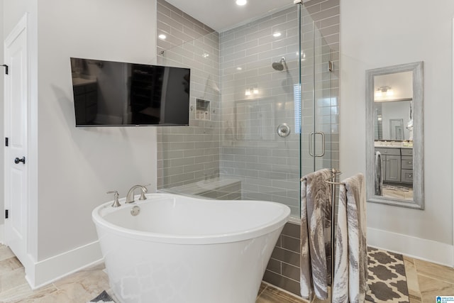 bathroom featuring independent shower and bath and vanity