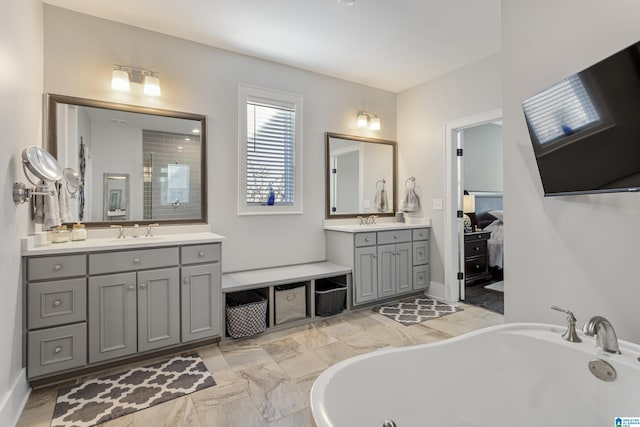 bathroom with a bathtub and vanity