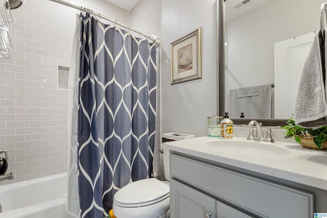 full bathroom featuring toilet, shower / bathtub combination with curtain, and vanity