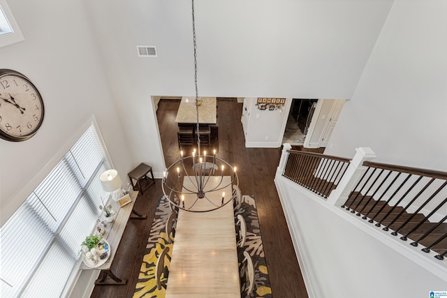 interior space with a notable chandelier and hardwood / wood-style floors