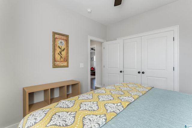 bedroom featuring ceiling fan and a closet