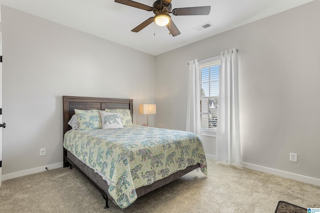 bedroom featuring ceiling fan and light carpet