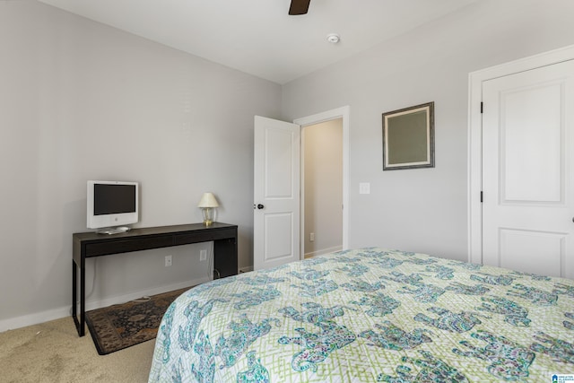 bedroom with ceiling fan and light carpet