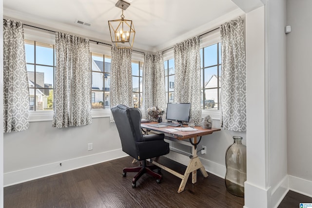 office area featuring a notable chandelier, dark wood-type flooring, and crown molding