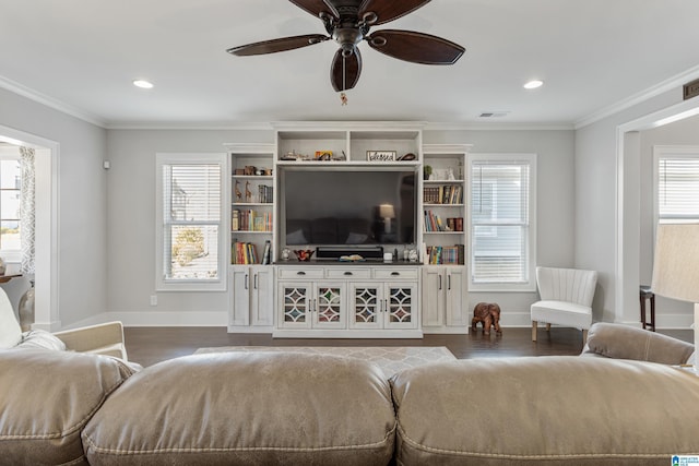 living room featuring ceiling fan, dark hardwood / wood-style flooring, and crown molding