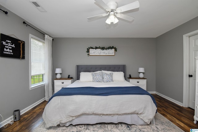 bedroom with ceiling fan and dark wood-type flooring