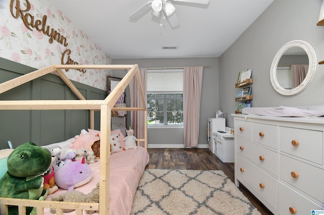 bedroom with ceiling fan and dark wood-type flooring