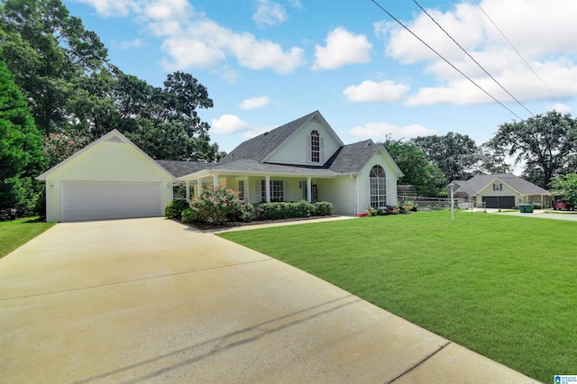 view of front of property with a front yard and a garage