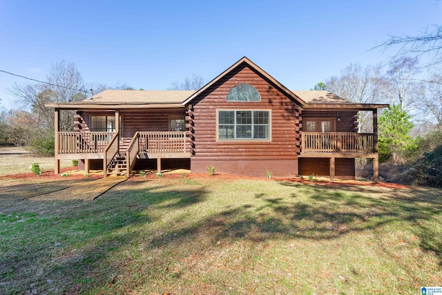 back of property with a wooden deck and a yard