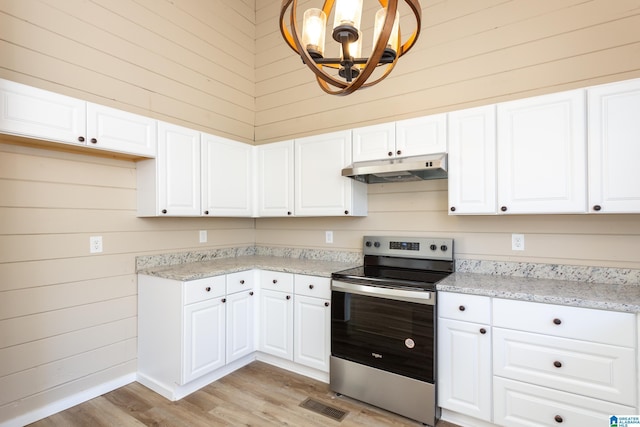 kitchen featuring stainless steel range with electric stovetop, light hardwood / wood-style flooring, white cabinets, a chandelier, and hanging light fixtures