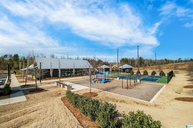 view of playground featuring tennis court