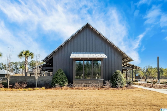 view of outdoor structure with a lawn