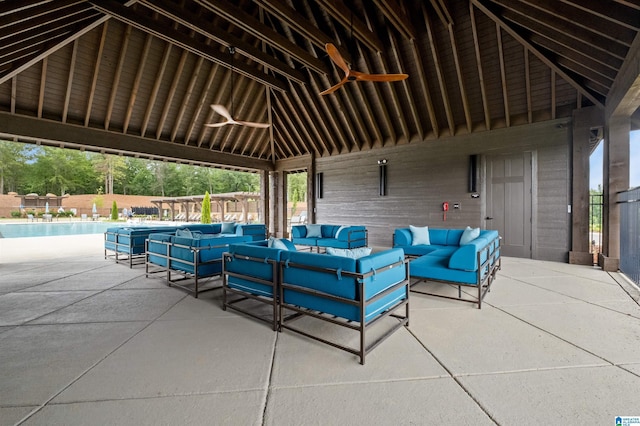 view of patio / terrace with a gazebo, an outdoor hangout area, and a community pool