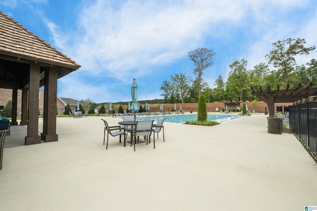 view of pool featuring a pergola and a patio