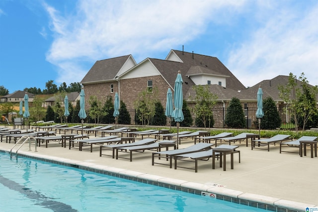 view of swimming pool featuring a patio area