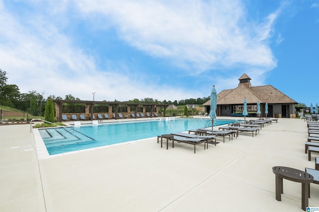 view of swimming pool featuring a patio area