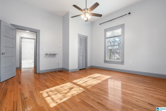 unfurnished bedroom featuring ceiling fan and light hardwood / wood-style floors