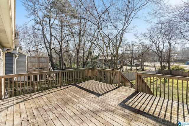 wooden terrace with a yard