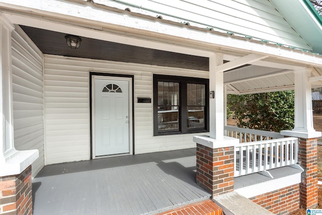 doorway to property featuring covered porch