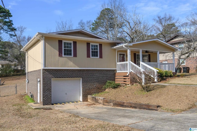 view of front of property with covered porch, a garage, and ceiling fan