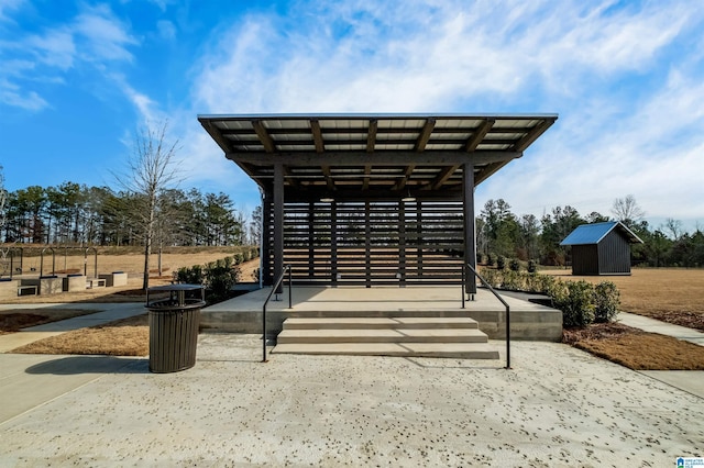 view of property's community featuring a storage shed