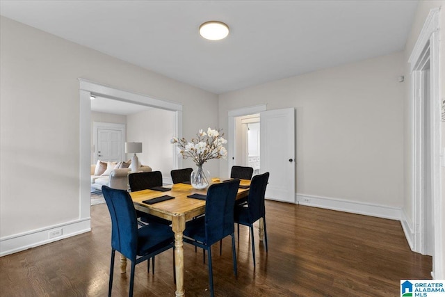 dining area featuring dark hardwood / wood-style floors