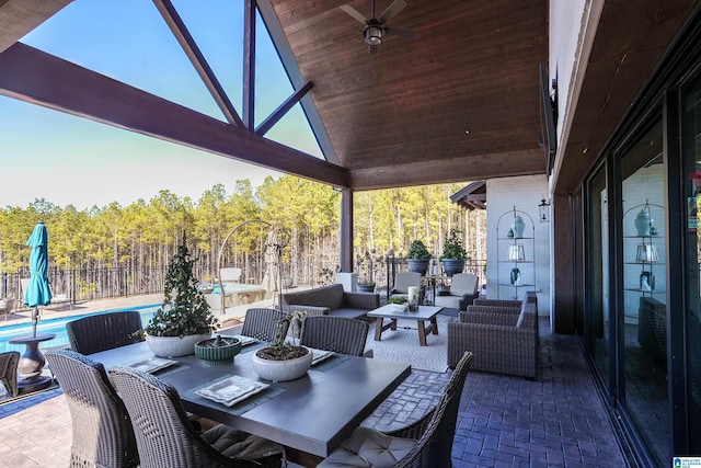 view of patio / terrace featuring ceiling fan, an outdoor hangout area, and a fenced in pool