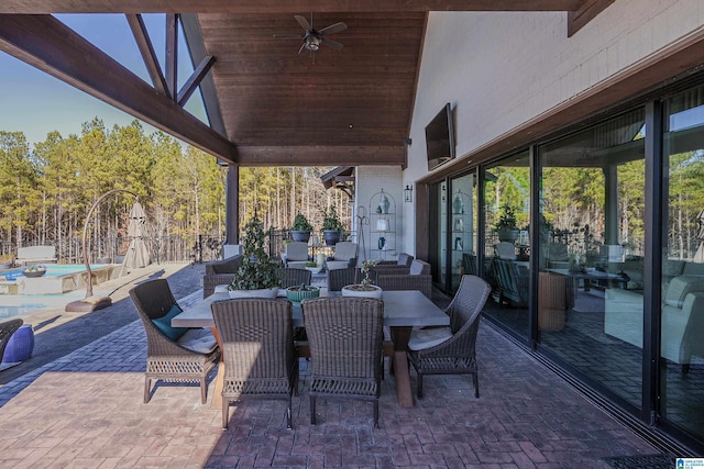 view of patio with ceiling fan and outdoor lounge area